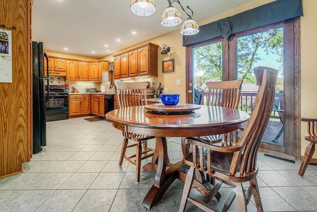 2711 Cedar Ave, Holmen, WI 54636 - dining space featuring light tile patterned floors and recessed lighting