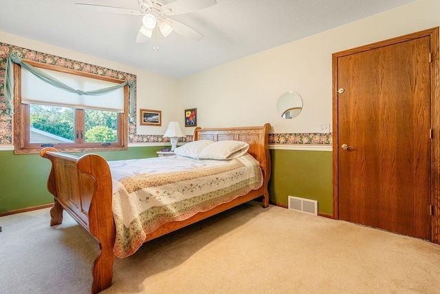 2711 Cedar Ave, Holmen, WI 54636 - carpeted bedroom with baseboards and a ceiling fan