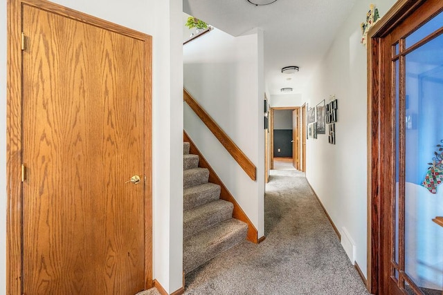 2711 Cedar Ave, Holmen, WI 54636 - staircase featuring carpet floors and baseboards