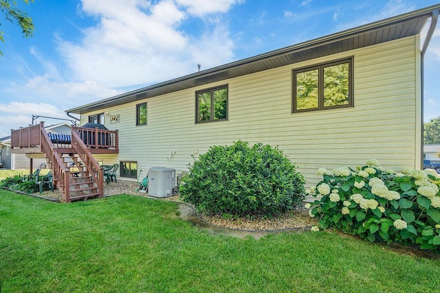 2711 Cedar Ave, Holmen, WI 54636 - rear view of property with stairs, a lawn, and a deck