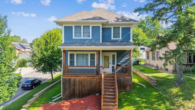 1661 Bush Ave, Saint Paul, MN 55106 - view of front facade featuring roof with shingles, stairway, a front yard, and covered porch
