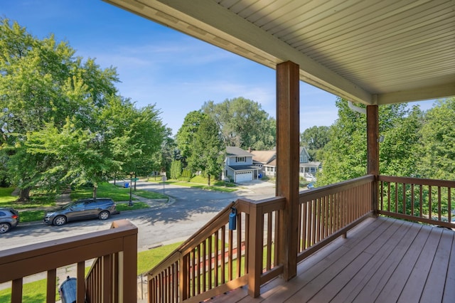1661 Bush Ave, Saint Paul, MN 55106 - wooden deck featuring view of scattered trees