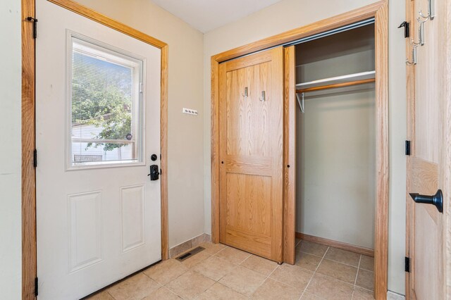 1661 Bush Ave, Saint Paul, MN 55106 - foyer entrance with baseboards and light tile patterned floors