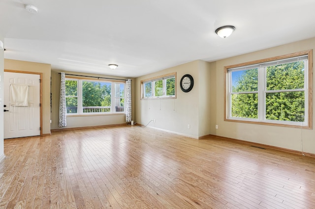 1661 Bush Ave, Saint Paul, MN 55106 - unfurnished living room with light wood-style floors