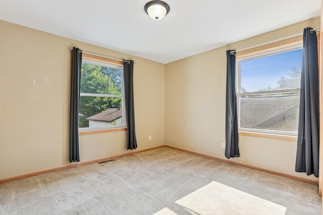 1661 Bush Ave, Saint Paul, MN 55106 - unfurnished room featuring carpet floors and baseboards