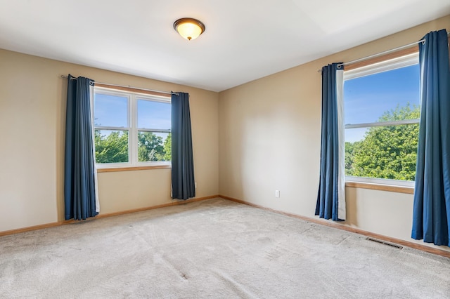 1661 Bush Ave, Saint Paul, MN 55106 - carpeted empty room featuring baseboards