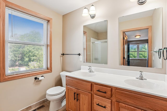 1661 Bush Ave, Saint Paul, MN 55106 - full bathroom featuring a shower stall and double vanity