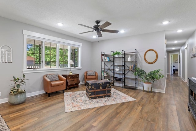 905 Sellards Dr, Dassel, MN 55325 - sitting room with wood finished floors, ceiling fan, recessed lighting, and a textured ceiling