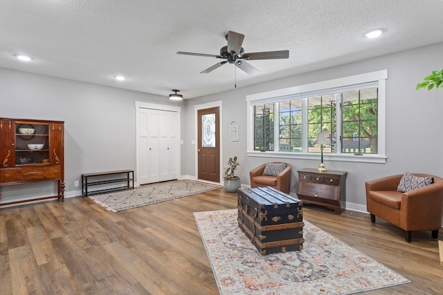 905 Sellards Dr, Dassel, MN 55325 - living room featuring ceiling fan, wood finished floors, a textured ceiling, and recessed lighting