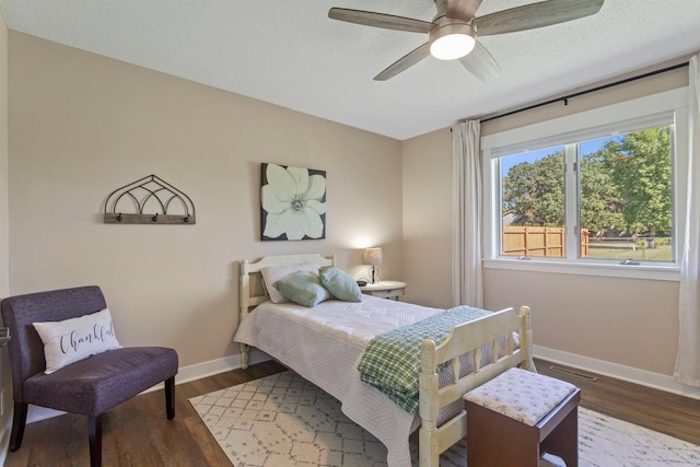 905 Sellards Dr, Dassel, MN 55325 - bedroom featuring wood finished floors, a ceiling fan, and a textured ceiling