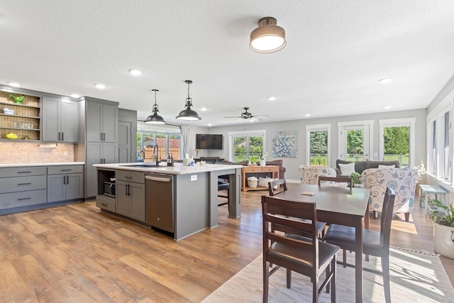 905 Sellards Dr, Dassel, MN 55325 - kitchen featuring stainless steel appliances, gray cabinetry, open floor plan, recessed lighting, and light countertops