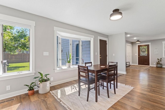 905 Sellards Dr, Dassel, MN 55325 - dining area with wood finished floors and baseboards