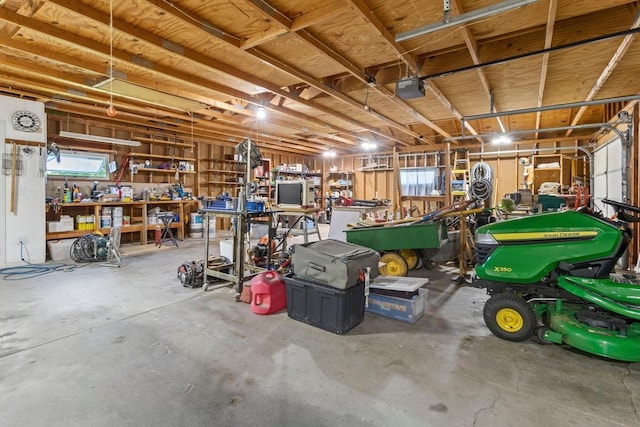 905 Sellards Dr, Dassel, MN 55325 - garage featuring a workshop area and a garage door opener