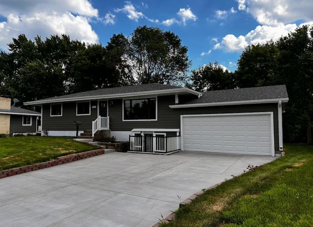 6113 Scott Ave N, Brooklyn Center, MN 55429 - view of front facade with driveway, a garage, and a front yard