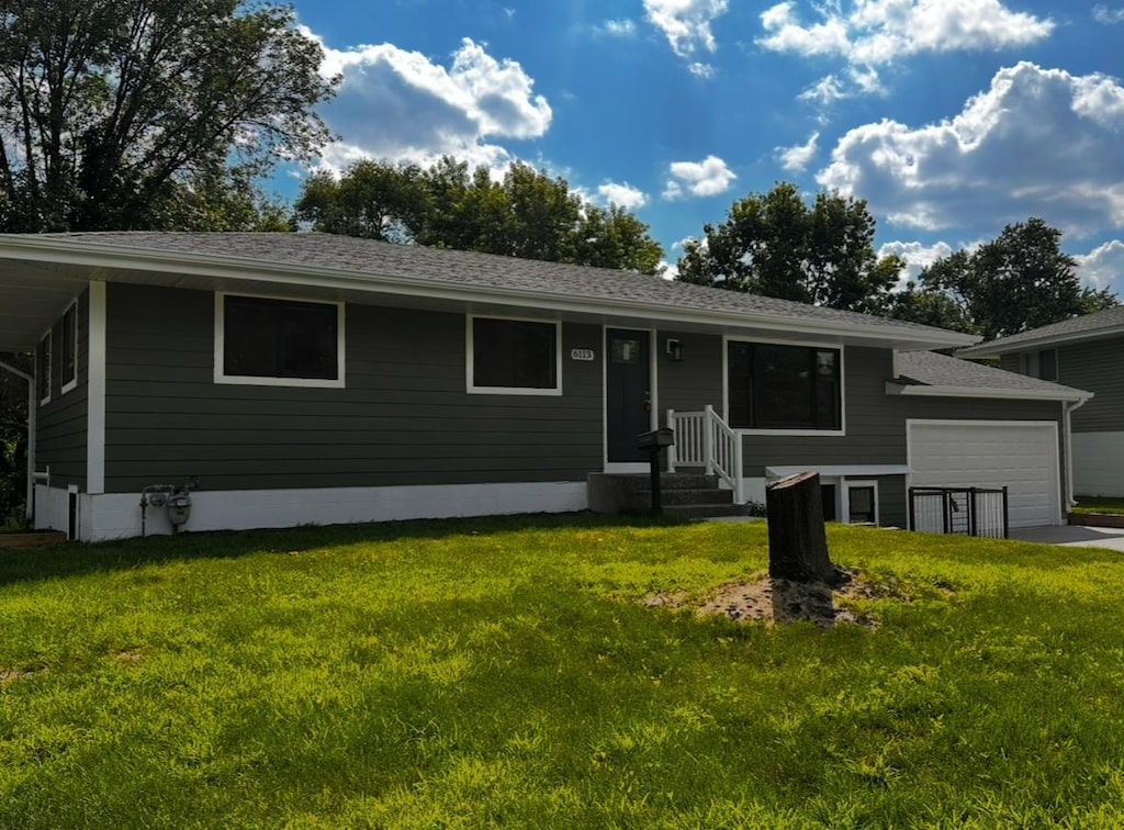 6113 Scott Ave N, Brooklyn Center, MN 55429 - ranch-style home featuring an attached garage, a front yard, driveway, and a shingled roof