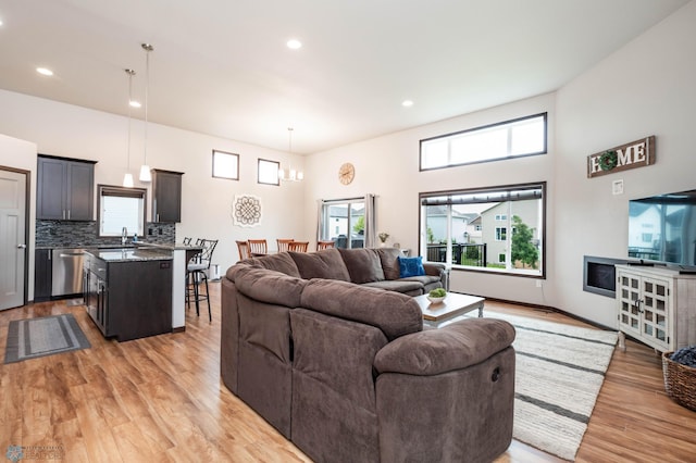 3137 6th St E, West Fargo, ND 58078 - living area with light wood finished floors, recessed lighting, and a high ceiling