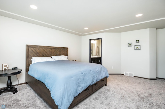 3137 6th St E, West Fargo, ND 58078 - bedroom with light carpet, recessed lighting, and connected bathroom