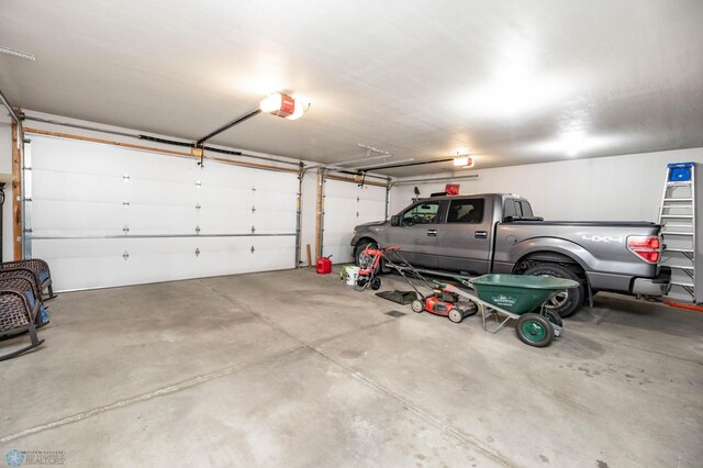 3137 6th St E, West Fargo, ND 58078 - garage featuring a garage door opener