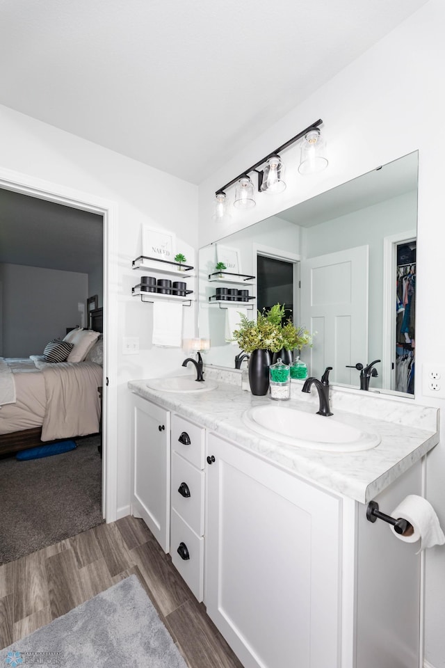 8827 Northern Lights Ave, Horace, ND 58047 - ensuite bathroom featuring double vanity and wood finished floors