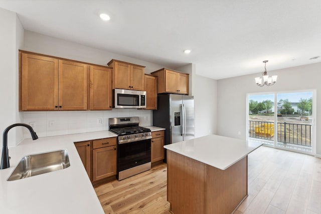 7419 E Ramsey Pkwy NW, Ramsey, MN 55303 - kitchen featuring stainless steel appliances, light wood-style flooring, decorative backsplash, brown cabinetry, and recessed lighting