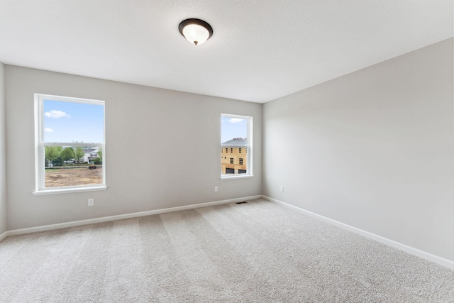 7419 E Ramsey Pkwy NW, Ramsey, MN 55303 - carpeted spare room featuring baseboards