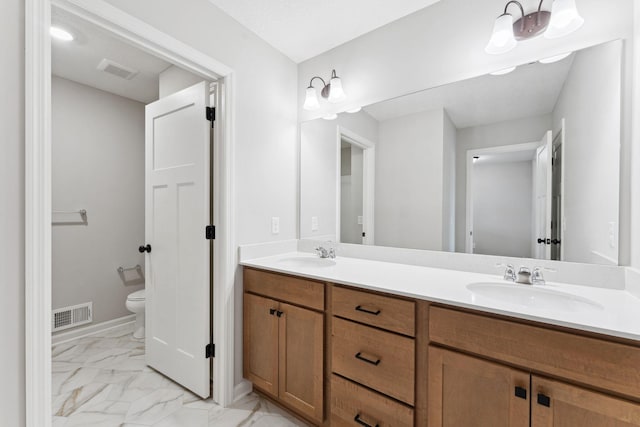 7419 E Ramsey Pkwy NW, Ramsey, MN 55303 - bathroom with double vanity and marble look tile flooring