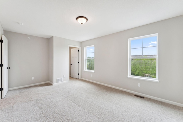 7419 E Ramsey Pkwy NW, Ramsey, MN 55303 - empty room with light carpet and a smoke detector