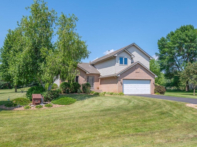 13680 57th St NE, Saint Michael, MN 55376 - view of front facade with asphalt driveway, a front lawn, and brick siding
