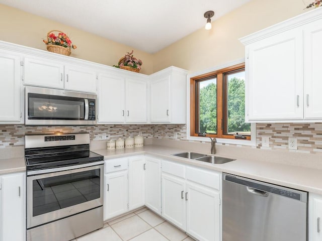 13680 57th St NE, Saint Michael, MN 55376 - kitchen featuring appliances with stainless steel finishes, light countertops, and white cabinetry
