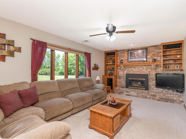 13680 57th St NE, Saint Michael, MN 55376 - living room with light colored carpet, built in shelves, a ceiling fan, and a fireplace