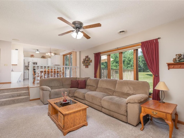 13680 57th St NE, Saint Michael, MN 55376 - living room with ceiling fan, light colored carpet, a chandelier, and a textured ceiling