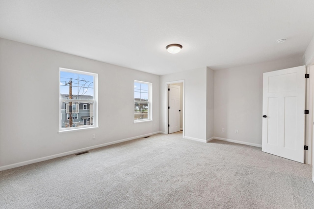 7415 E Ramsey Pkwy NW, Ramsey, MN 55303 - unfurnished bedroom with light colored carpet and baseboards