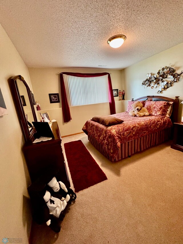 1815 49th St S, Fargo, ND 58103 - bedroom with carpet and a textured ceiling