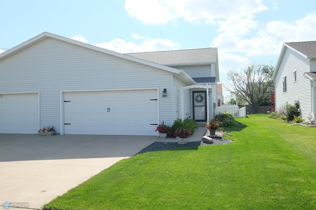 1815 49th St S, Fargo, ND 58103 - view of front of property with concrete driveway, an attached garage, and roof with shingles