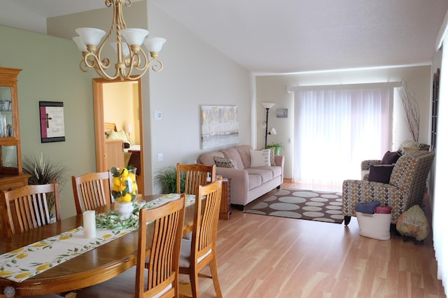 1815 49th St S, Fargo, ND 58103 - dining room with light wood finished floors, vaulted ceiling, and a chandelier