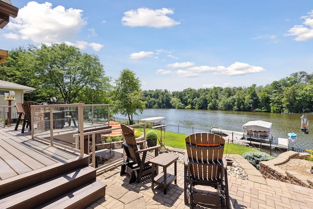 708 Riverside Dr N, North Hudson, WI 54016 - view of patio featuring a water view, a boat dock, boat lift, and a grill