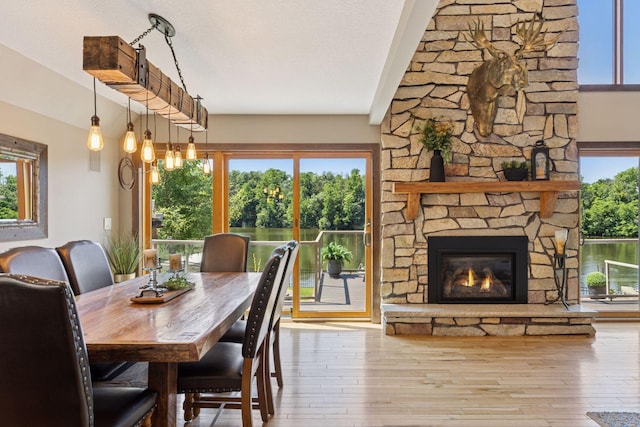 708 Riverside Dr N, North Hudson, WI 54016 - dining room with wood-type flooring and a stone fireplace