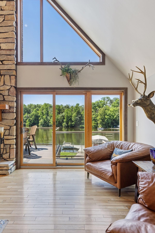 708 Riverside Dr N, North Hudson, WI 54016 - living area featuring vaulted ceiling and hardwood / wood-style flooring