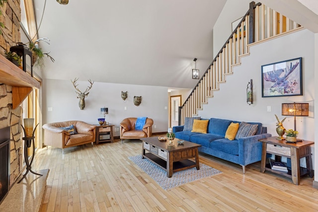 708 Riverside Dr N, North Hudson, WI 54016 - living area featuring a high ceiling, stairs, and light wood-style flooring