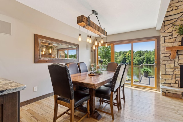 708 Riverside Dr N, North Hudson, WI 54016 - dining room with light wood-style floors and baseboards
