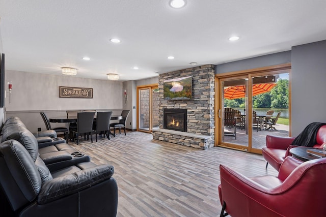 708 Riverside Dr N, North Hudson, WI 54016 - living room with recessed lighting, a fireplace, and wood finished floors