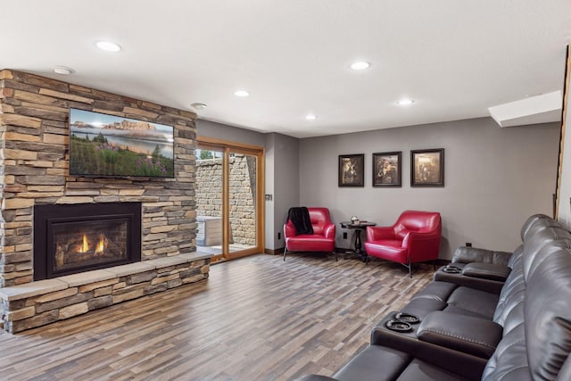 708 Riverside Dr N, North Hudson, WI 54016 - living room featuring wood finished floors, recessed lighting, and a fireplace