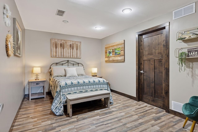 708 Riverside Dr N, North Hudson, WI 54016 - bedroom featuring light wood-style flooring and baseboards