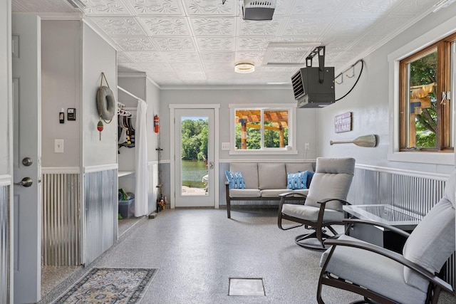 708 Riverside Dr N, North Hudson, WI 54016 - sitting room featuring an ornate ceiling, a wainscoted wall, ornamental molding, and a heating unit