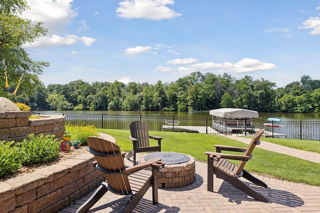 708 Riverside Dr N, North Hudson, WI 54016 - view of patio with an outdoor fire pit and a water view