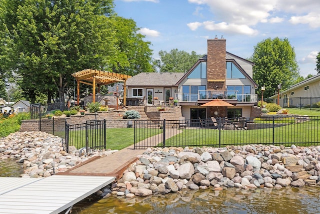 708 Riverside Dr N, North Hudson, WI 54016 - rear view of property with a pergola, a chimney, a water view, and a patio