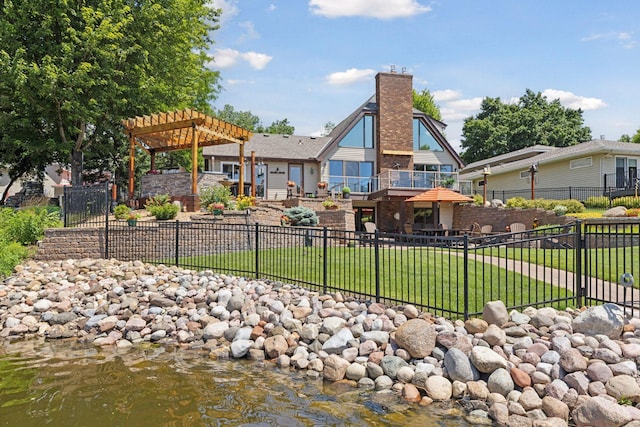 708 Riverside Dr N, North Hudson, WI 54016 - back of house featuring a pergola and a chimney