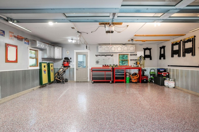 708 Riverside Dr N, North Hudson, WI 54016 - garage with a workshop area and a garage door opener