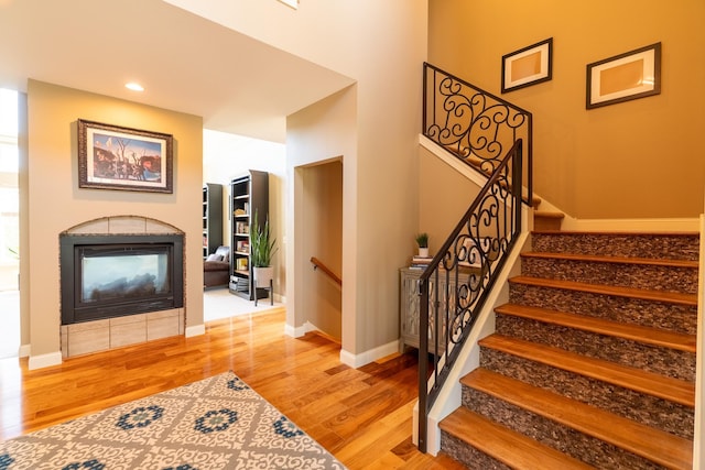 60515 235th St, Madison Lake, MN 56063 - stairway with a fireplace and wood finished floors
