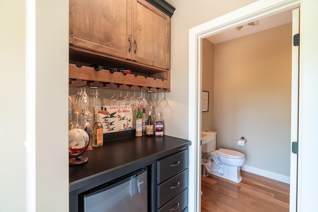 60515 235th St, Madison Lake, MN 56063 - indoor dry bar featuring light wood-style flooring and baseboards